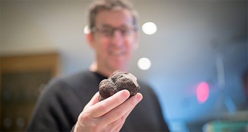Chef Ken Frank holding truffle